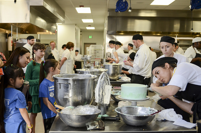 Student is working on the cake
